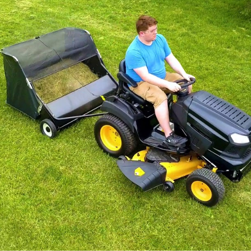 Lawn sweeper with sitting tractor